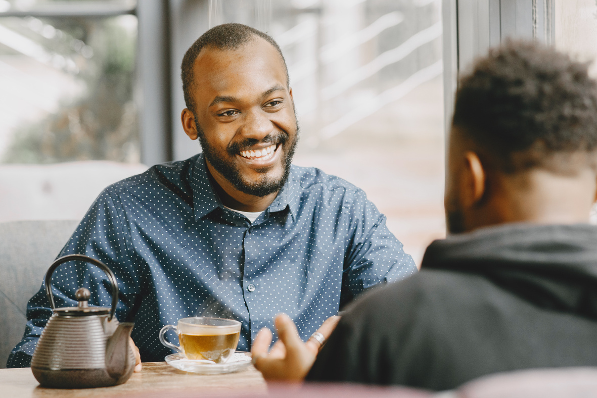 Men Talking in a Cafe